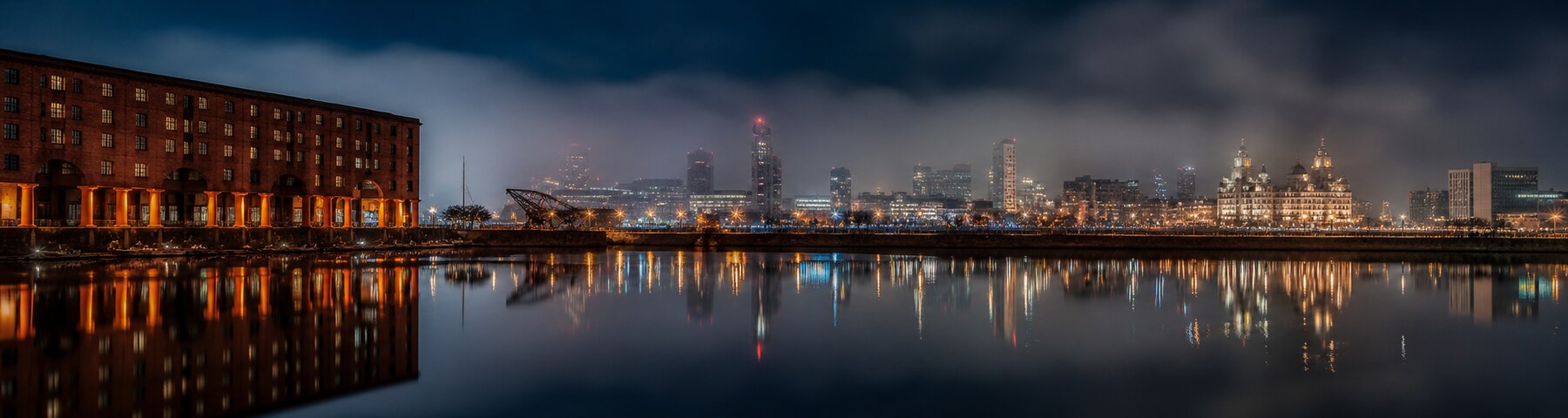 Liverpool dock lights reflected in the harbour at night